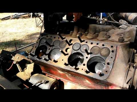 Ford Flathead V8 running with one head removed.