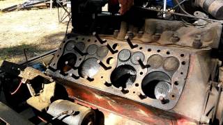 Ford Flathead V8 running with one head removed.