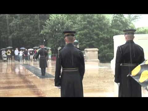changing of the guard at tomb of unknown during thunder storm.
