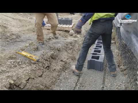Retaining Wall installation knock off Lug & Laying first course by Vern Dueck
