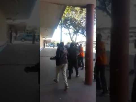 WATCH: Mob justice on Zim traffic cop for causing taxi crash WATCH: Mob justice on Zim traffic cop for causing taxi crash