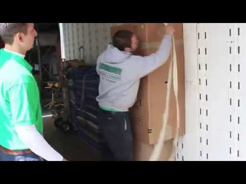 Part of a video titled How to move boxes on your back with a strap - YouTube
