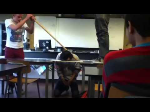 Physics teacher breaking wood with his head during class