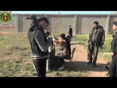 لقطات من تدريبات الرماية التي يخوضها مقاتلوا لواء فرسان حوران