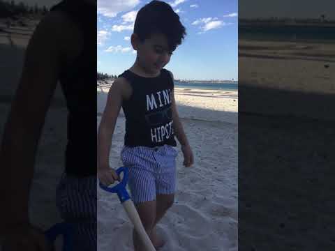 Summer fun kids alone at the beach playing