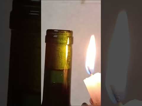 How to open a wine bottle without a corkscrew, candle edition #wine #winebottle #hacks #easyhometips