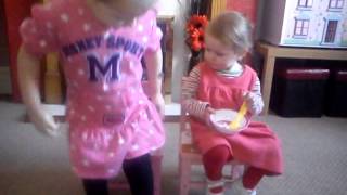 Emilie and Freya acting out "Little Miss Muffet"