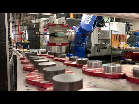 Haas DS30Y with Motoman 6 axis robot loading