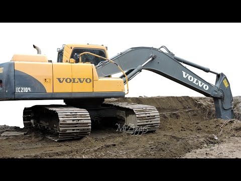 Excavator Digging Dirt Loading Dump Truck Volvo EC210B