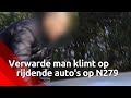 Verwarde man klimt op auto's op N279. ( Beelden: SQ Vision)