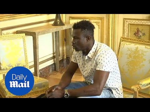 French President Emmanuel Macron meets with Malian migrant hero