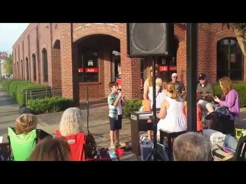 Luke singing What Makes You Beautiful