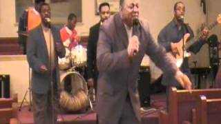 Pastor Leroy Spears singing "I'm going to a city"