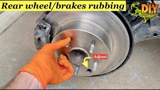 Rear brakes rubbing - Adjust emergency brake