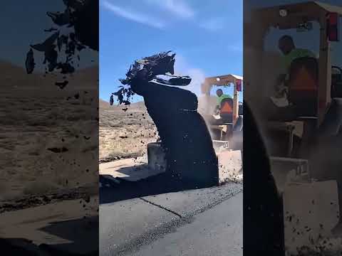 Heavy machinery demolishes road, clean and powerful