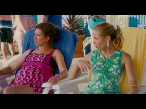 The extremely muscular man is so cool that those ladies laugh when he plays a joke