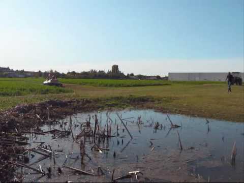 BUFO hovercraft is flying over land and water