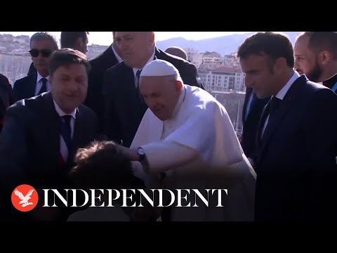 Pope Francis blesses children on Marseille visit as French President Emmanuel Macron watches on