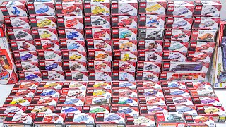 The miniature cars from the collection are on display, featuring unique Tomica models and new Tomica