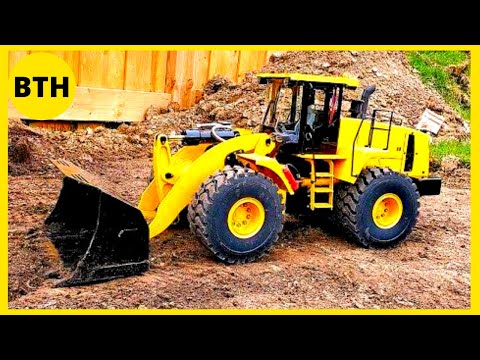 Excavator Caterpillar 990 And Caterpillar 992B Wheel Loaders Loading Coal On Trucks - Coal Mine