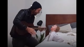 When her dad begins to play the guitar, this baby girl has the best reaction ever!