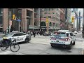 Toronto police ambulance escort shuts down Yonge St in Toronto after shooting