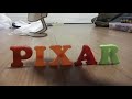 Logos in Alphabet magnets form: Pixar logo