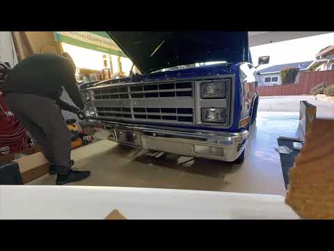 We swap out the stock Chevy truck grill with a new chrome one!