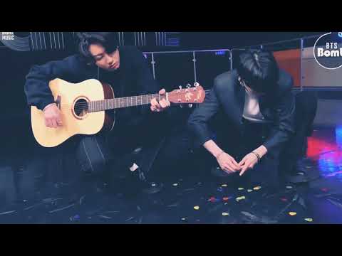 BTS JK Playing Guitar.🎸. And SUGA.💜.collect some plectrums. 😂.at this time suga is like maooo😽
