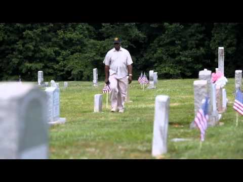 Levester Smarr explains why he places flags at Rose Hill Cemetery