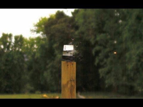 SPLITTING A CARD WITH A TRACER IN SLOW MOTION.