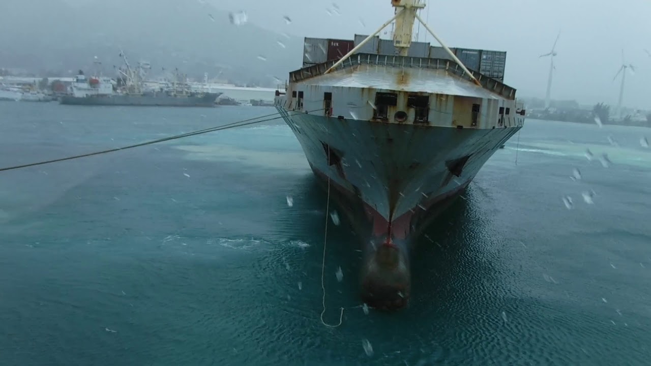 Ship breaking her mooring lines at Port Victoria, Seychelles