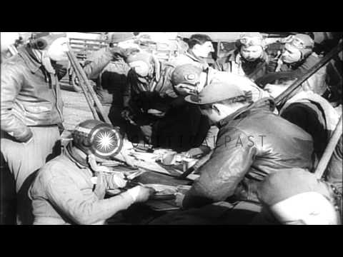Ground and air crew of planes bomb German held territory in France and Netherland...HD Stock Footage