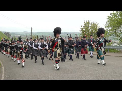 Massed Bands marching above Stonehaven in Aberdeenshire Scotland to War Memorial Commemoration