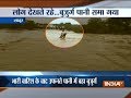 Maharashtra: Old man washed away in flood water while trying to cross the bridge in Latur