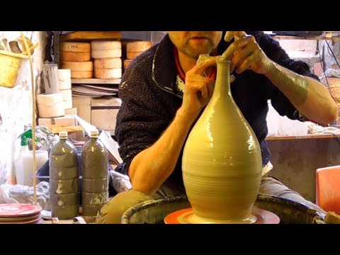 Making a Long Necked Pottery Vase on the Wheel.