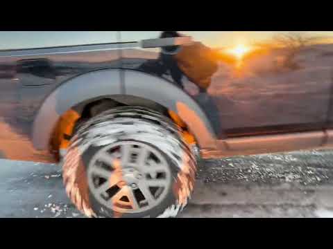 Audi rescued by Land Rover on icy road