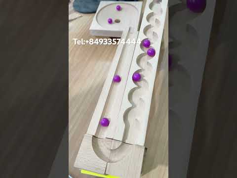 The purple marble runs on a zigzag path into a swirling circle