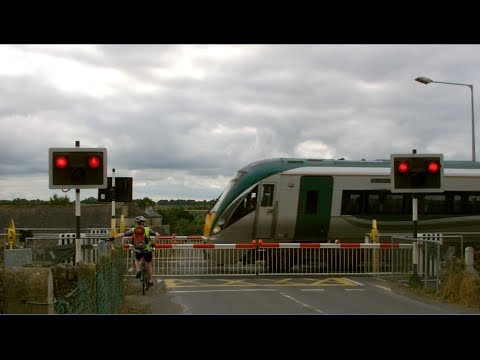 Irish Rail 22000 ICR (new logos) passes Ballyreddin Level cCrossing, Kilkenny