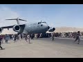 HEARTBREAKING SCENES AT KABUL AIRPORT AS AFGHANS TRY TO FLEE ON U S AIRFORCE PLANE TALIBAN TAKEOVER