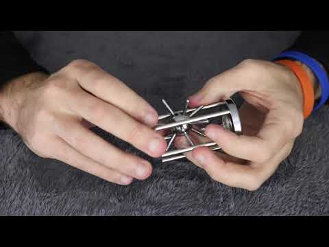 Solving The Caged SPIKED BALL Puzzle