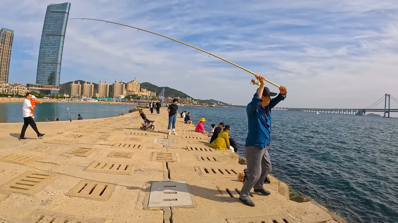 Immersive street-level walking tour through Dalian Xinghai Square, China, showcasing authentic urban landscapes, local architecture, and the vibrant atmosphere of the city's neighborhoods