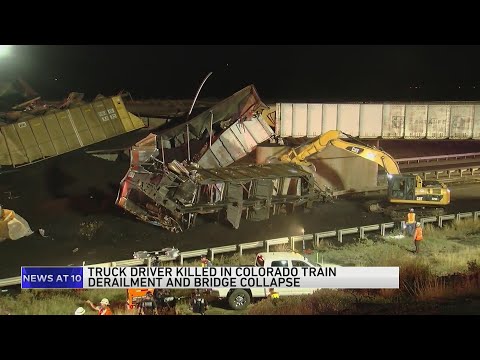 Truck driver killed when train derailment collapses Colorado bridge, spilling coal cars onto highway