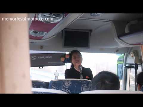 North Korean guide singing & karaoke on the bus
