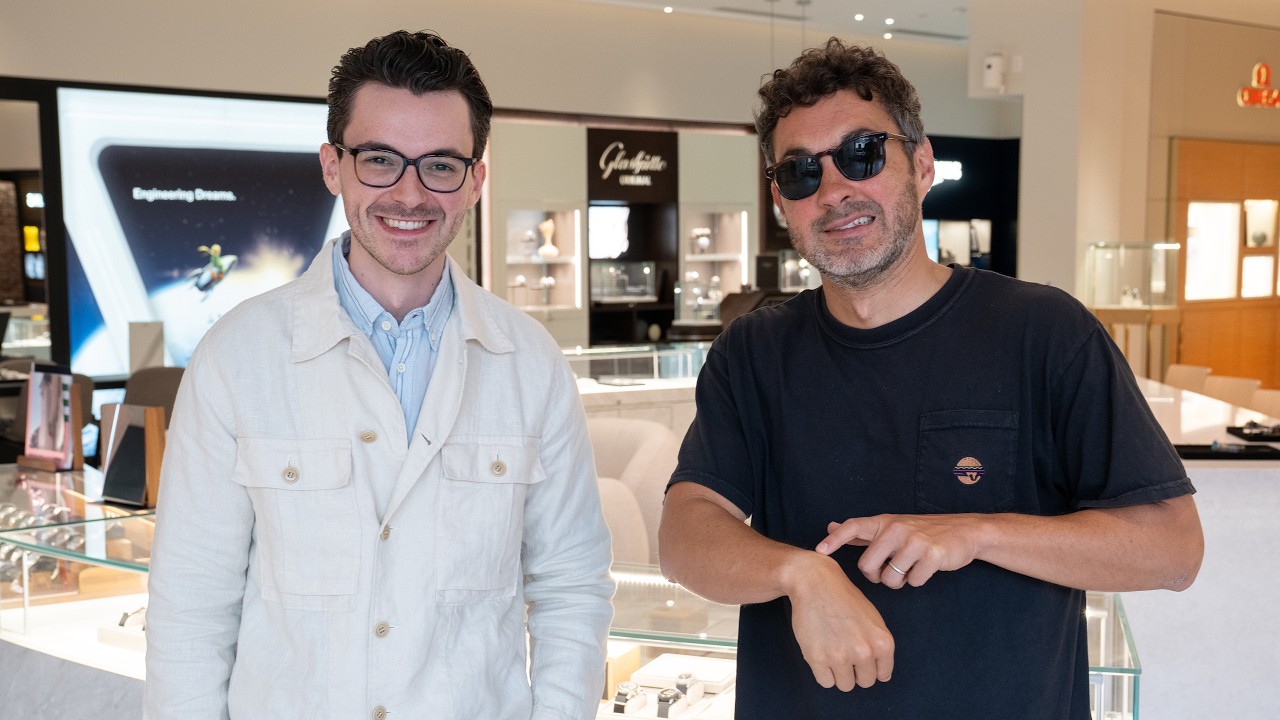 Mark Normand and Teddy Baldassarre browsing various watch brands and models in a store