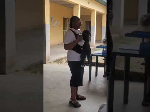 Our Volunteer, explaining who we are /Word of God to the Nursing Mothers during our Easter Outreach