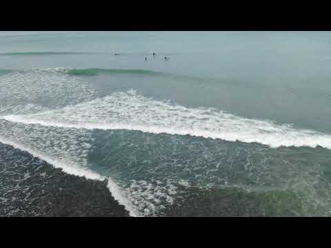 Aerial footage of Etretat and surfers