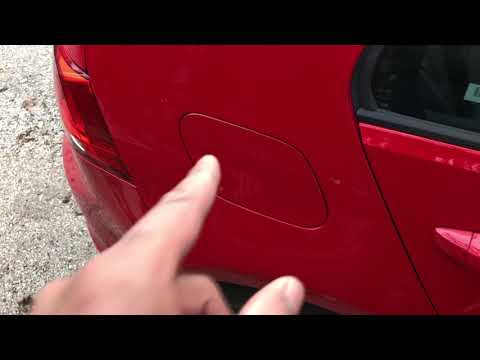 Part of a video titled VOLKSWAGEN GOLF OPEN GAS CAP - HOW TO - YouTube