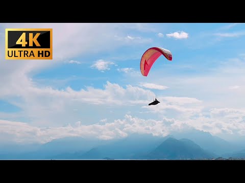 Free Stock Video: Paragliding under a blue sky HD 4K