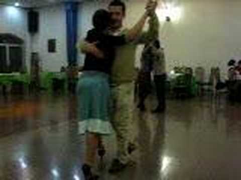 Felipe Zarzar  and  Mamié Sancy  are  dancing  to  a  tango